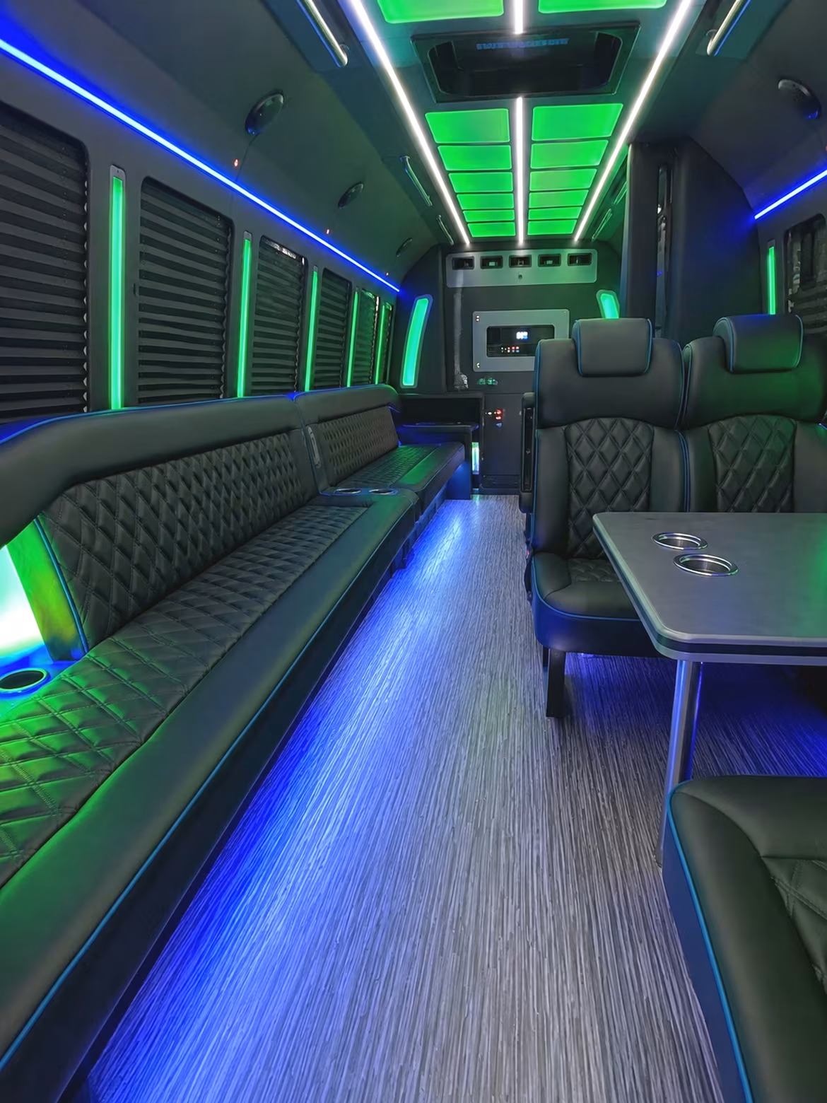 Friends laughing during a party bus celebration in Riverside